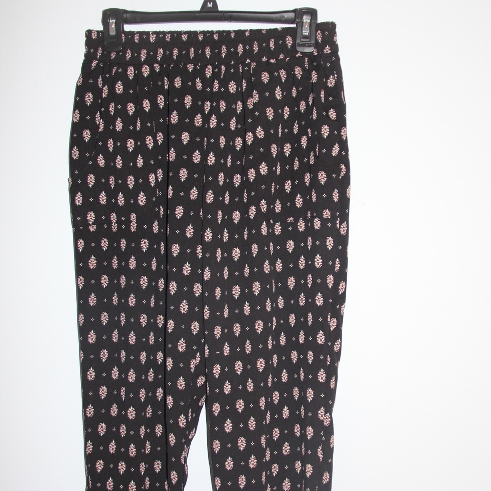 Black pattern fabric pants with cinched legs.